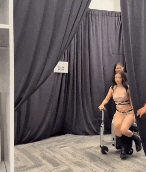 Blackpink playing cutely backstage at the concert